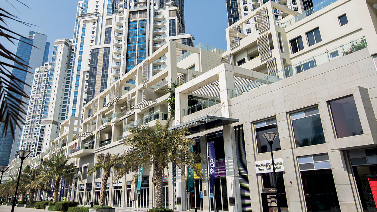 Bay Avenue retail facade and palm-lined walkway in Business Bay, Dubai