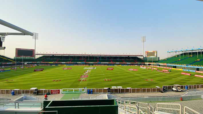 The Sevens Stadium empty in daylight, showing the pitch, stands and floodlights