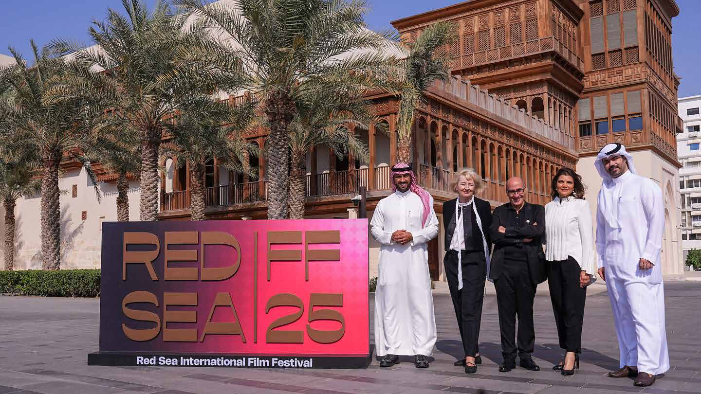 Red Sea International Film Festival 2025 signage in Jeddah with festival representatives