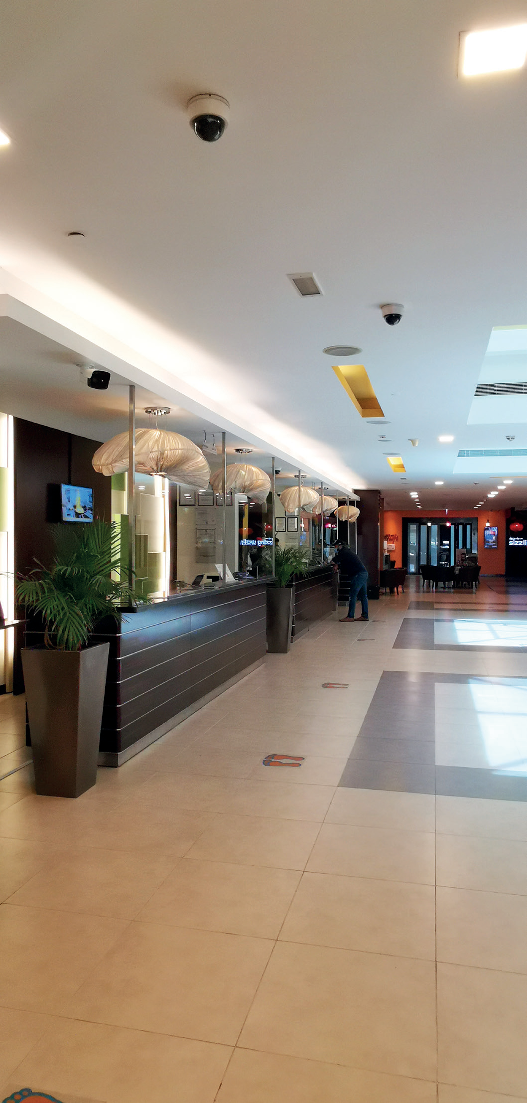 Citymax hotel reception and lobby with ceiling-mounted network and security devices