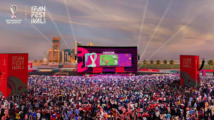Fan festival stage and crowd at dusk with the Doha skyline behind