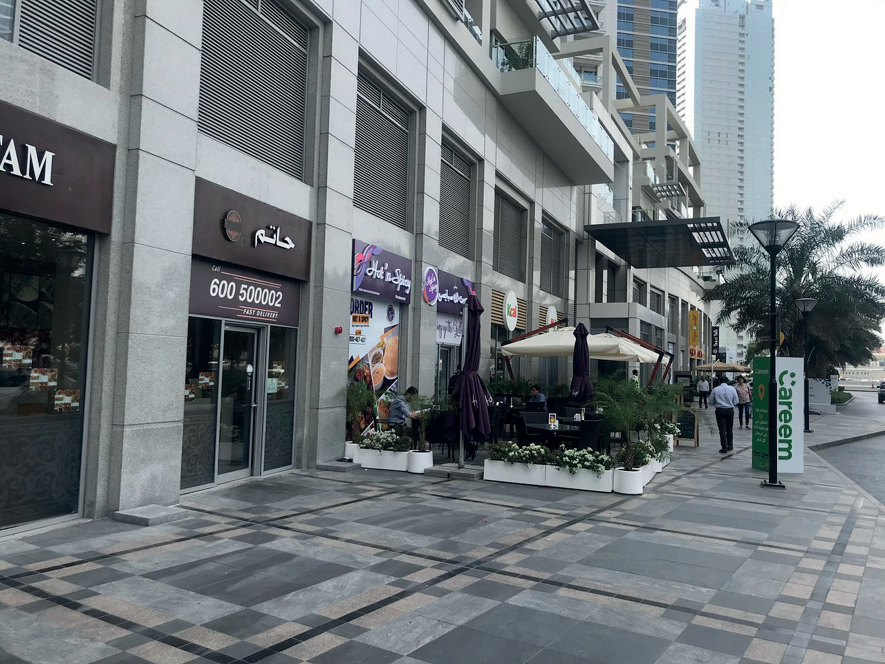 Outdoor F&B walkway at Bay Avenue with café seating and shopfronts