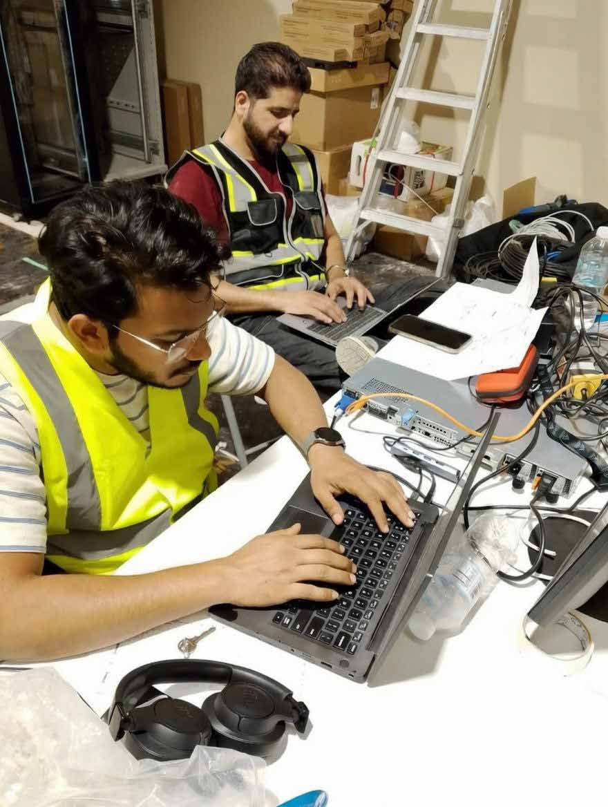 EZELINK engineers configuring network switches on site during the festival build